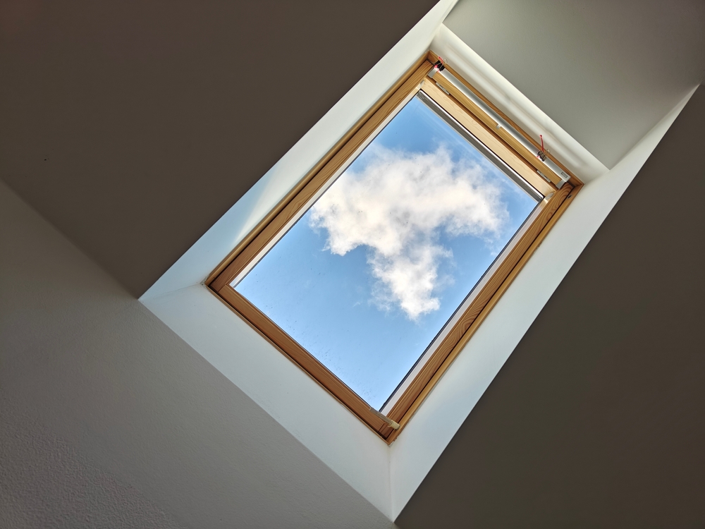 The,Photo,Captures,An,Upward,View,Through,A,Skylight,With
